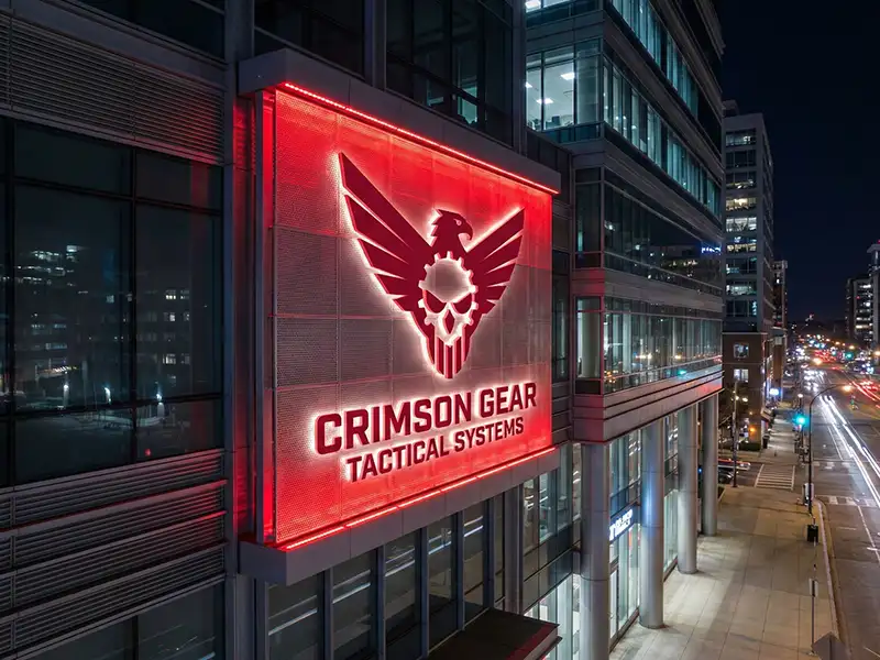 Red vector eagle logo with spread wings containing a white gear and skull on the chest